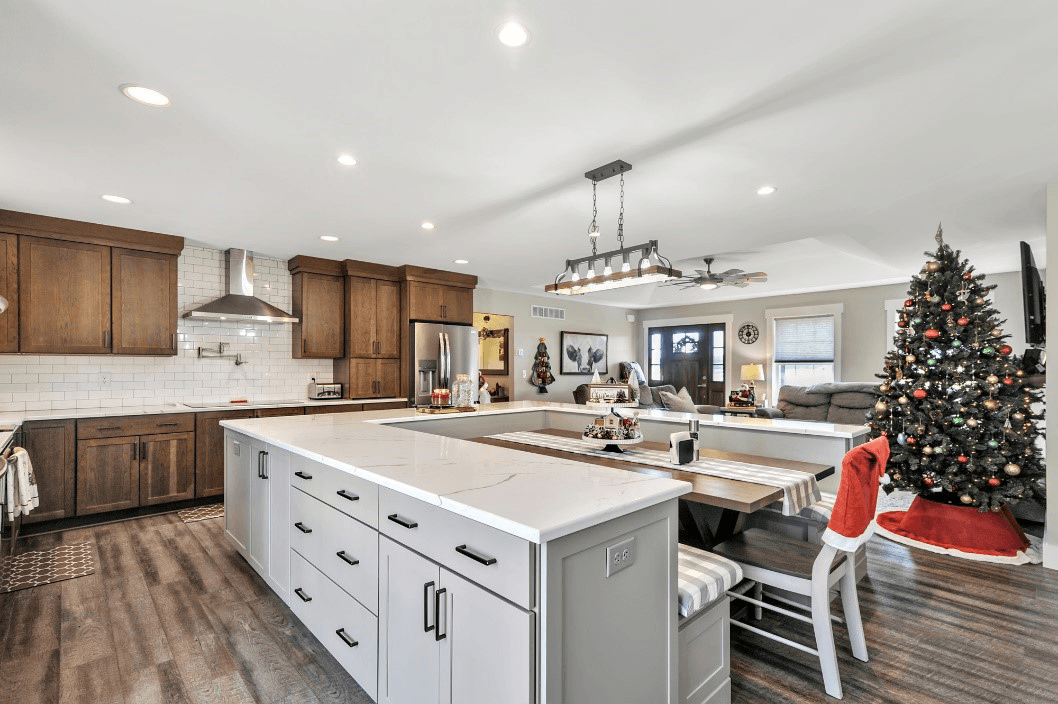 A cozy kitchen with a decorated Christmas tree in the background, creating a festive holiday atmosphere.