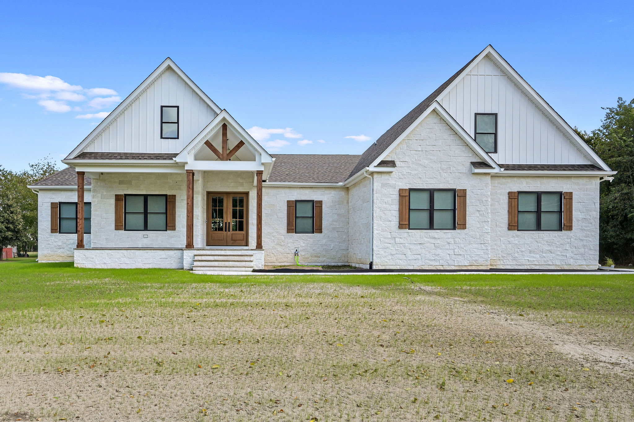 A custom home featuring a spacious front porch